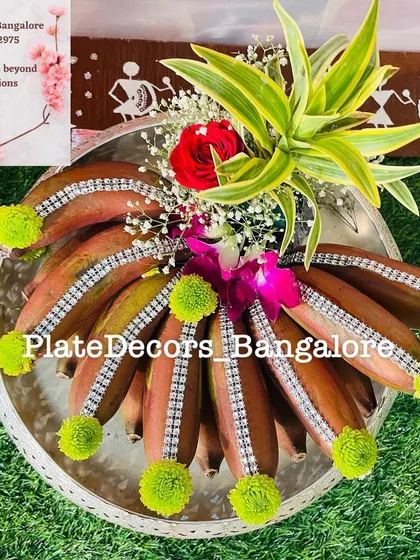 Red bananas adorned with rhinestone strips and green pompoms. I love playing with different colors and textures to make each fruit platter stand out.