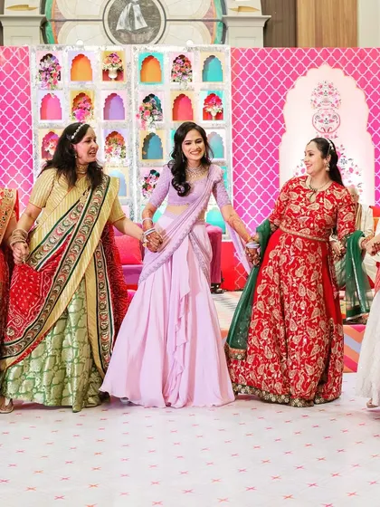 A heartwarming moment of family bonding, as the bride dances with the women in her family during the Sangeet celebrations.