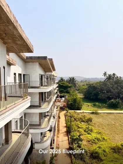 An exterior shot of a project under construction, with a view of the lush green landscape. This image reflects our commitment to contextual design that respects and integrates with its environment.