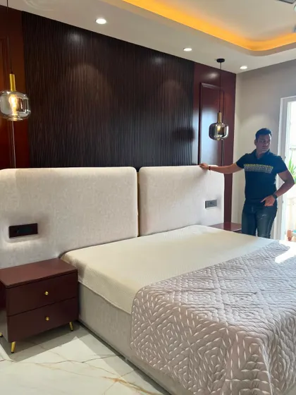 Another angle of the split headboard bed, showing the hanging pendant lights.