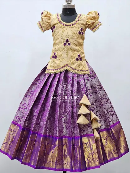 Another beautiful combination, this time with a beige blouse featuring purple floral embroidery, paired with a purple Banarasi skirt.