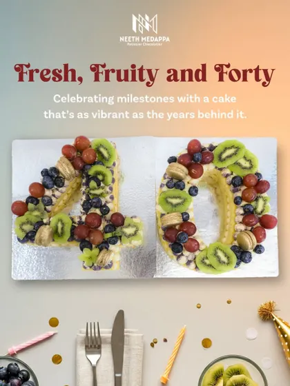 Fresh, fruity, and forty! This unique number cake is a vibrant way to celebrate a milestone, topped with fresh grapes, kiwi, blueberries, and macarons.