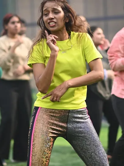 A student finding her groove during our corporate Zumba event. Our sessions are designed to be fun and accessible for everyone, regardless of fitness level.