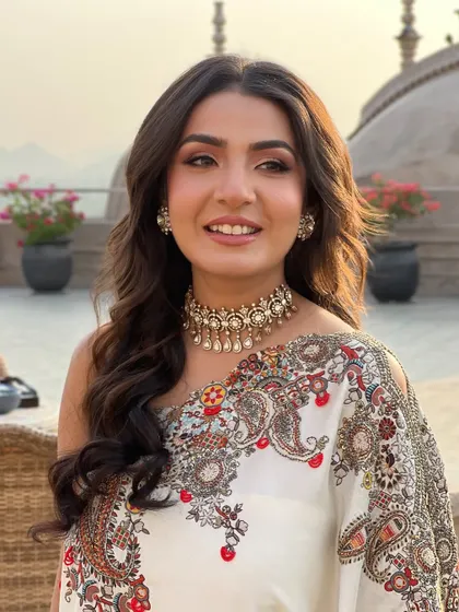 A portrait of the bride, her soft waves and natural makeup creating a fresh and elegant look.