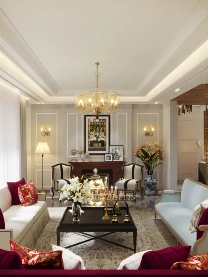 A wide shot showing the complete living room layout, including a fireplace and multiple seating arrangements for large gatherings.