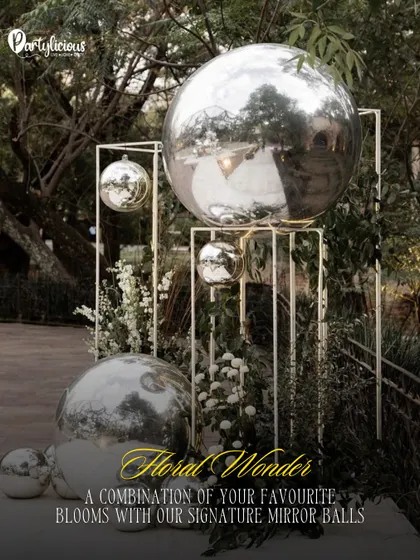 Floral Wonder. A beautiful combination of our signature mirror balls with fresh blooms and modern metal structures for a sophisticated outdoor installation.