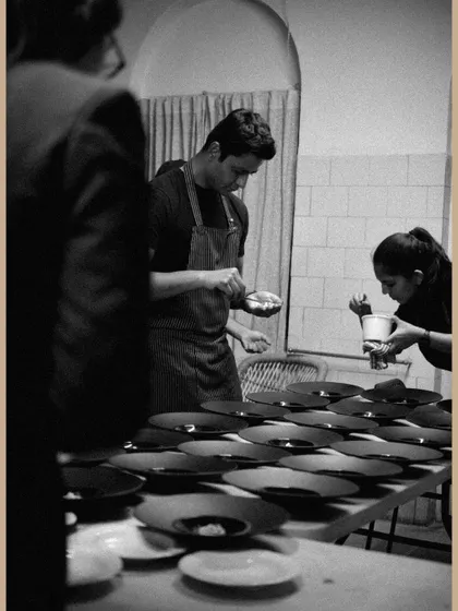 Another shot of the team at work during the saree exhibition event.