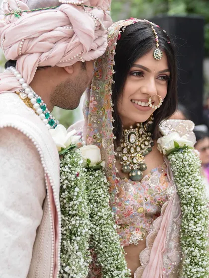 A sweet, candid moment between the couple. Tanisha’s natural makeup look allows her joyful expressions to be the focus.