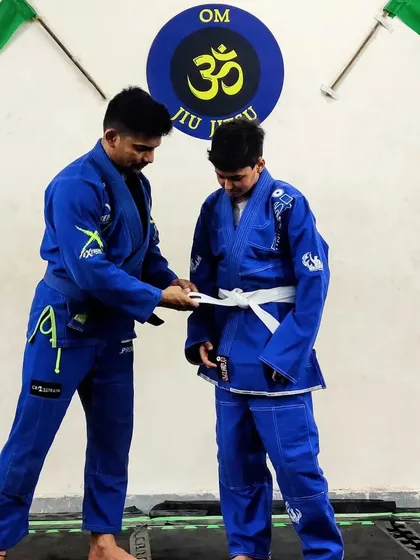 The moment of promotion. This stripe is a symbol of dedication and a milestone on the long journey of martial arts.