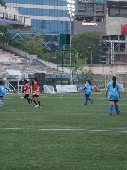 A wide view of the match, showing the tactical shape and positioning of our team during a league game.