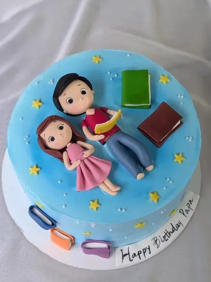 Night-time tales are the best with daddy. This cake, ordered by a daughter for her papa, shows them reading together under a starry sky.