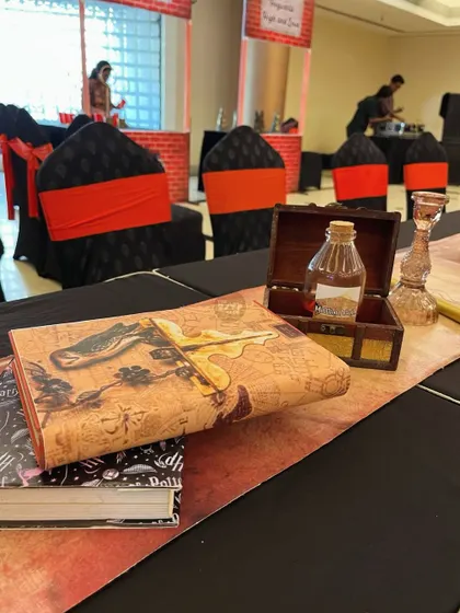 More magical table decor, including a 'Monster Book of Monsters' and potion bottles.