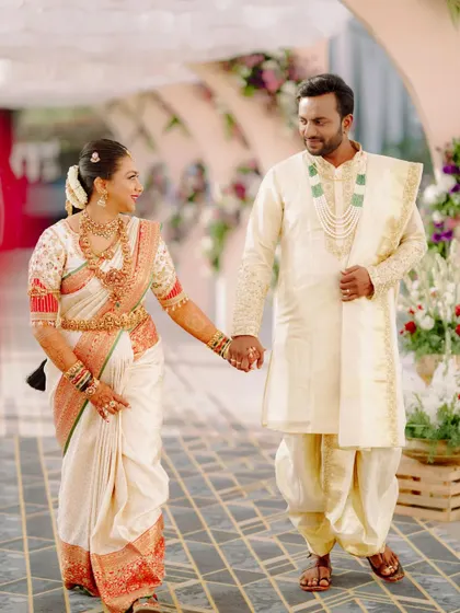 A complete bridal look. I designed this custom embroidered blouse and coordinated the groom's matching cream sherwani for a picture-perfect wedding day ensemble.