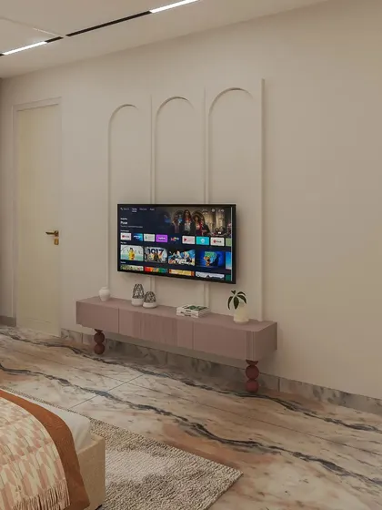 The TV unit in the grandparents' bedroom is simple and functional, with arched molding details on the wall to add a touch of elegance.