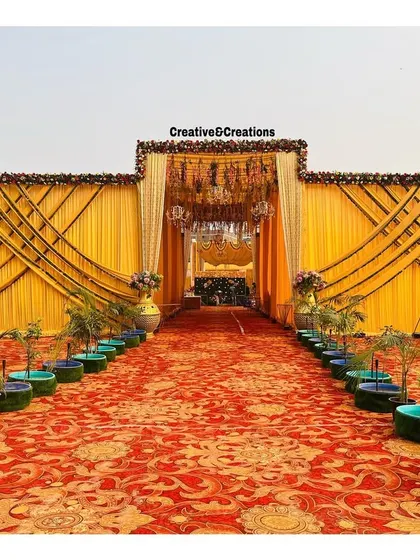 The entrance to the grand yellow venue, showcasing the impressive scale and symmetry of the design.