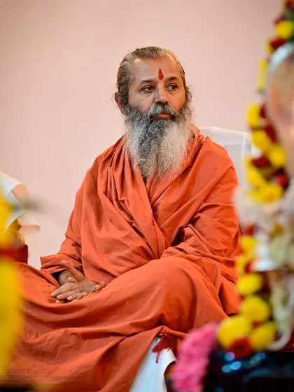 A senior teacher sits in contemplation during the Maha Sudarshan Homa. Our festivals are a time for everyone to deepen their own spiritual practice.