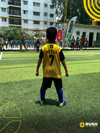 A young player stands ready for kickoff. These friendly matches are excellent preparation for the competitive Karnataka Youth League season.