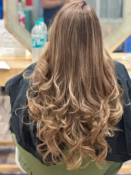 The back view of this stunning golden blonde transformation, showing the flow and dimension.