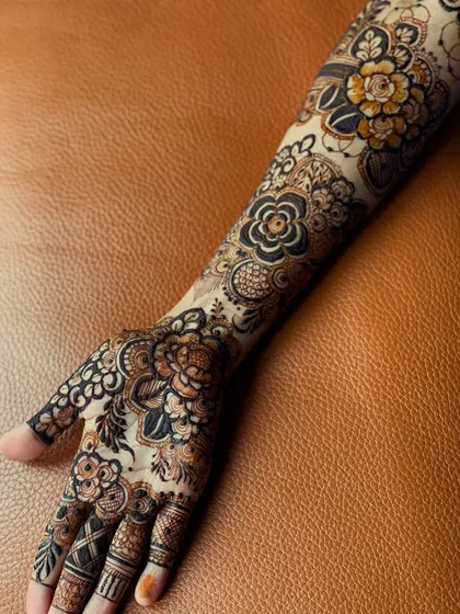 This full-arm signature floral design shows how the pattern extends from the palm to the elbow, creating a seamless and elegant look.