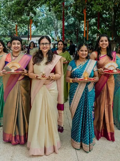 The bride's squad, all dressed in beautiful sarees, ready to welcome the groom. We capture the color, tradition, and excitement of the wedding party.