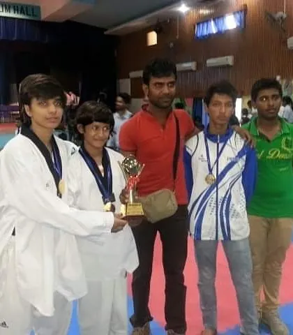 With my students celebrating their win with a trophy and medals. Every victory, big or small, is a testament to their dedication.