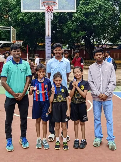 Celebrating our U-11 girls' basketball team who emerged as runners-up in their tournament. Posing with their medals and coaches, they show the rewarding results of their hard work.