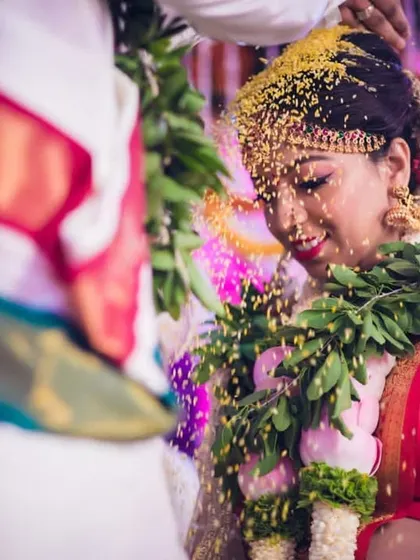 A beautiful candid shot from a wedding ceremony. The bride's natural, happy expression is what I aim to enhance, ensuring the makeup feels like a better version of her own skin.