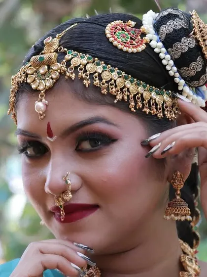 Another close-up showing the flawless makeup and the detailed craftsmanship of the hair accessories.