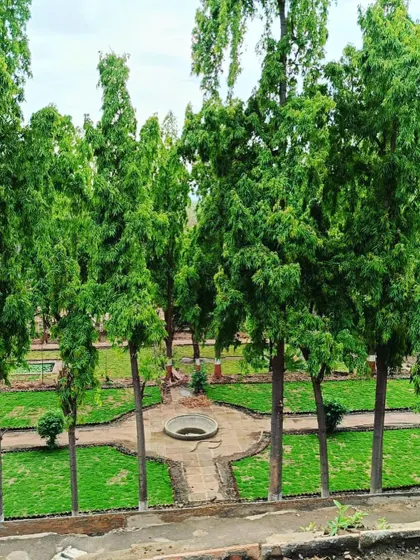 Looking down on the symmetrical garden design at Dalal Bagh, showcasing the precise layout of paths and lawns.