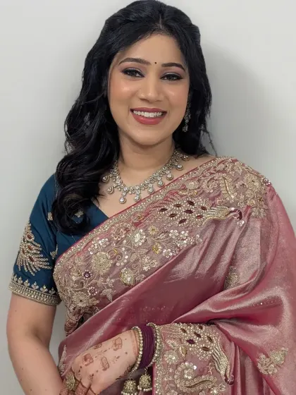 Timeless glam for a member of the bridal party. This look features a soft brown smokey eye, glowing skin, and a beautiful smile, perfect for any wedding event.