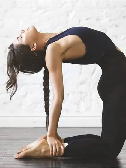 Ustrasana, or Camel Pose, is a deep backbend that opens the heart and stretches the entire front of the body.