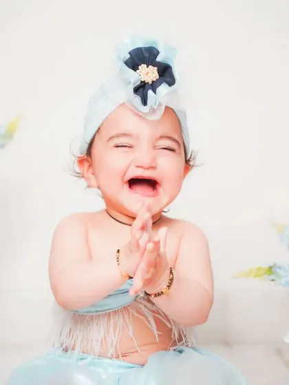 A big, happy laugh that lights up the room. We aim to capture your baby's true personality in every shot.