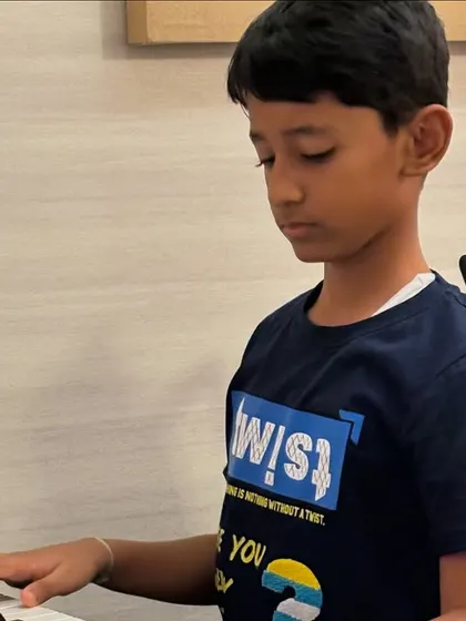A student practices his piece, learning to read music and coordinate his hands. These foundational skills are essential for musical growth.