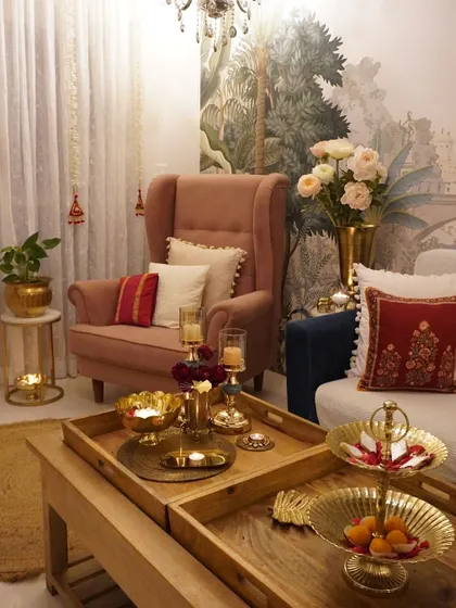 A cozy corner of my living room during Diwali. The brass candle holders and festive cushions create a warm and inviting atmosphere.