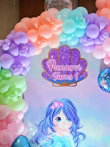 A detail shot of the mermaid-themed backdrop.
