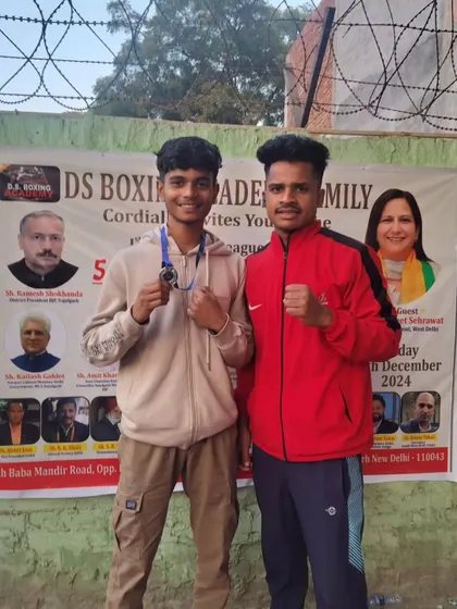 Posing for a photo after a successful tournament. The camaraderie among our boxers is as important as the individual wins.