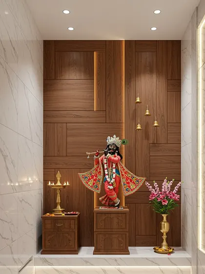 A modern pooja room design featuring a stunning wooden paneled wall, marble flooring, and a central Krishna idol. The hanging bells add a traditional touch.