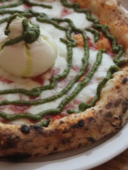 Fresh, creamy burrata meets the vibrant flavors of basil pesto on our classic Neapolitan crust.