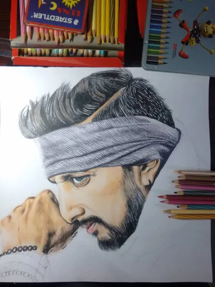 A work-in-progress shot of the Kiccha Sudeep color sketch. This shows the drawing before completion, with the base colors and shading laid down before the final details are added.
