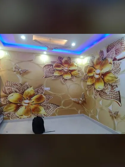 This 3D wallpaper with golden-brown flowers gives the room a warm and luxurious feel. The lighting from the PVC ceiling highlights the metallic details in the design.