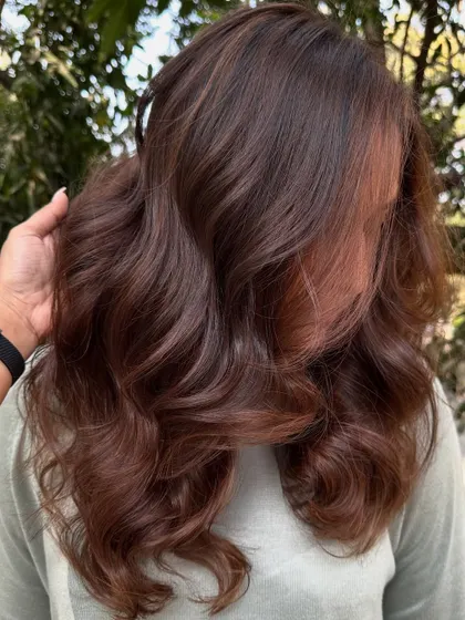 A portrait of the client with her new 'Chocolate Pecan Dream' hair.