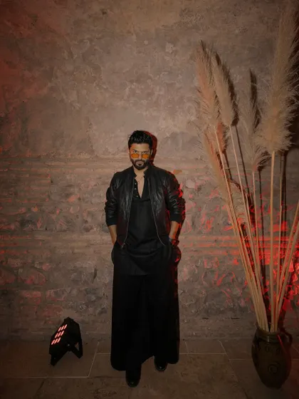 Rocking an all-black Indo-western look with a leather jacket. This outfit is perfect for an after-party or a trendy music event.