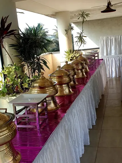 Another angle of the balcony buffet, showing the full length of the setup against the backdrop of the city. I ensure the presentation is impeccable, no matter the location.