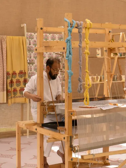 To add to the authenticity of the Kashmiri market theme, I included a real weaver working at a loom, showcasing local craftsmanship.