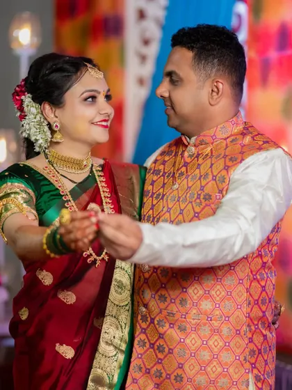 Swapnil and Ankita share a dance during their engagement party. The warm lighting and their happy expressions make this a wonderful memory.