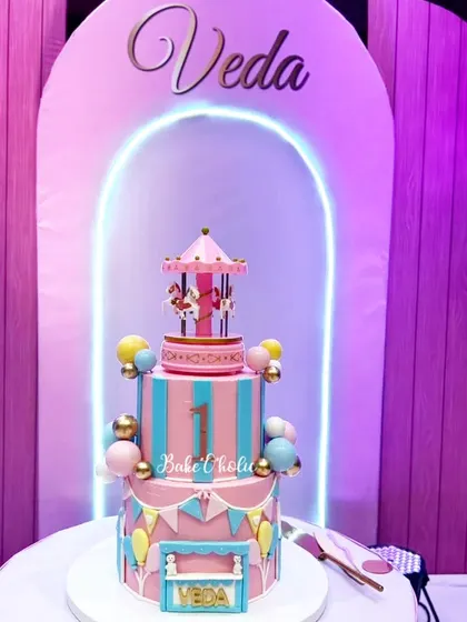 The carousel cake as the centerpiece of Veda's beautiful birthday party. It fits the decor perfectly.