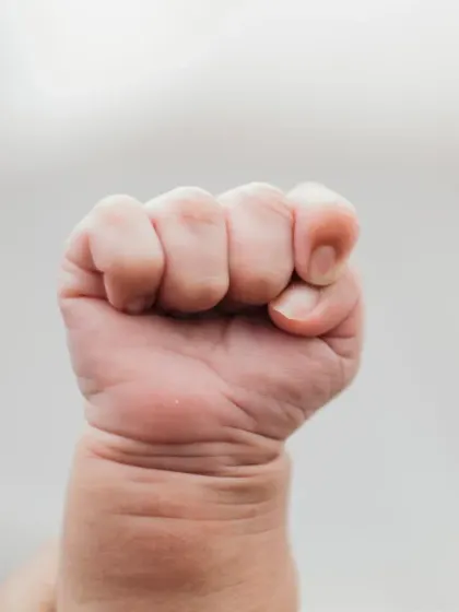 The same tiny fist in color, a simple and beautiful detail shot.
