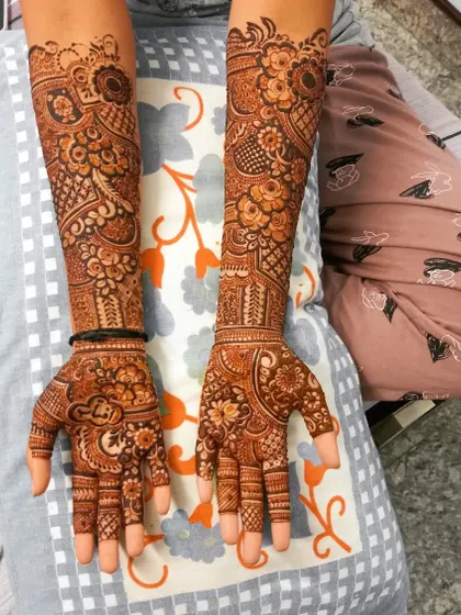 A full coverage design for an engagement bride. The pattern is a beautiful mix of floral and traditional motifs, perfect for the occasion.