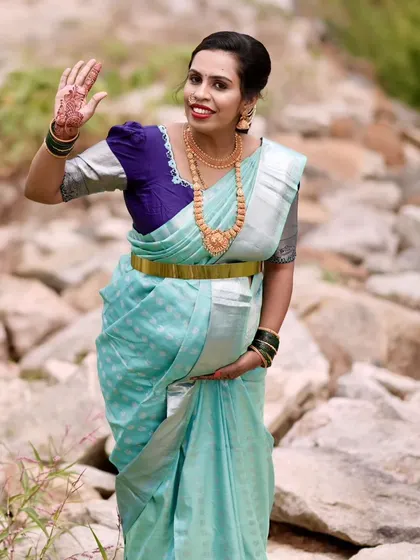 A full-length view of my friend's seemantha look. The light blue saree is paired with a contrasting blouse and a simple, elegant makeup style.