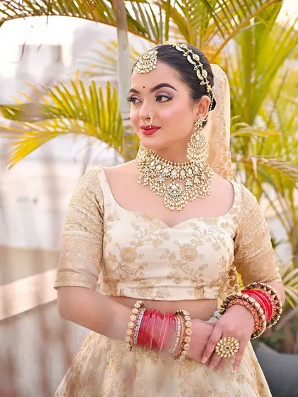 A three-quarter view of the bride, looking elegant and poised.